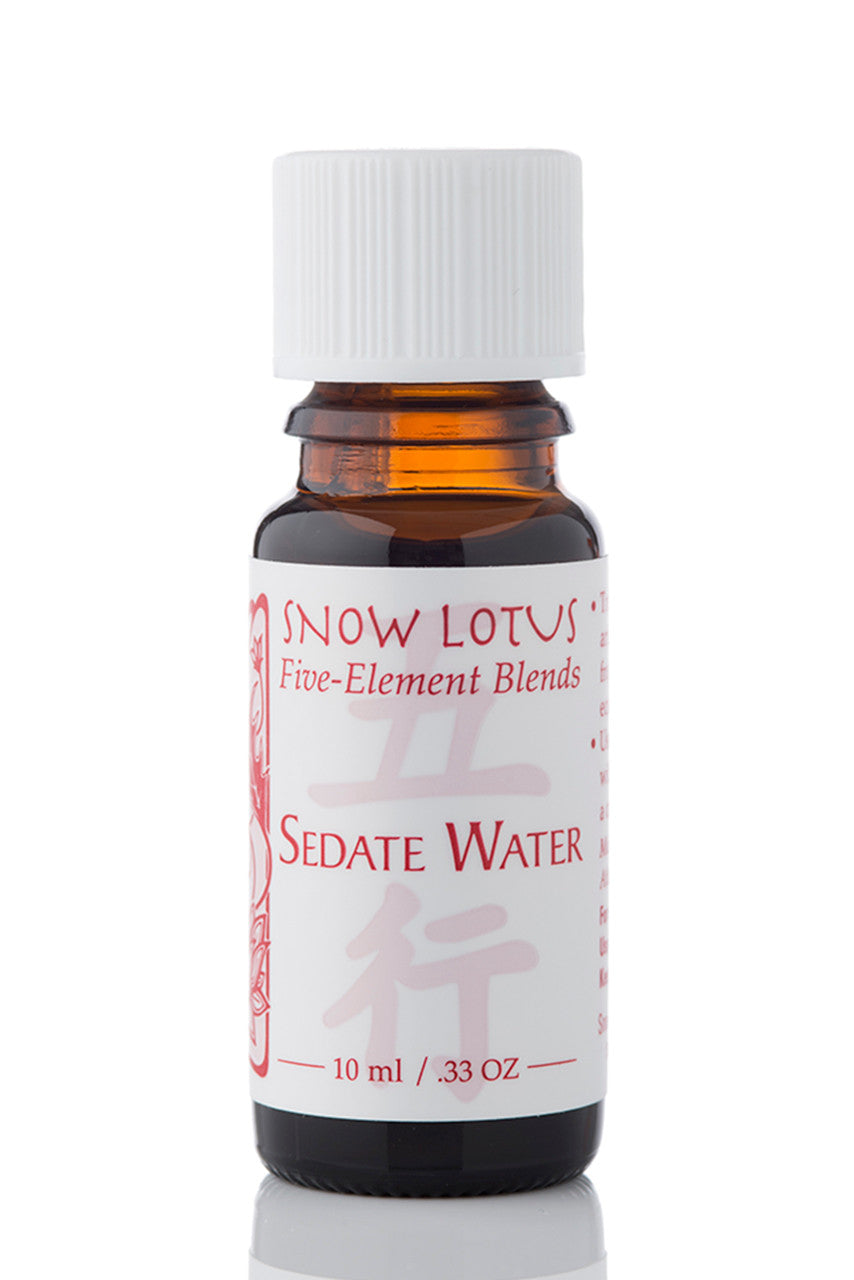 Snow Lotus Sedate Water - Five Element Essential Oil Blend in an amber glass bottle
