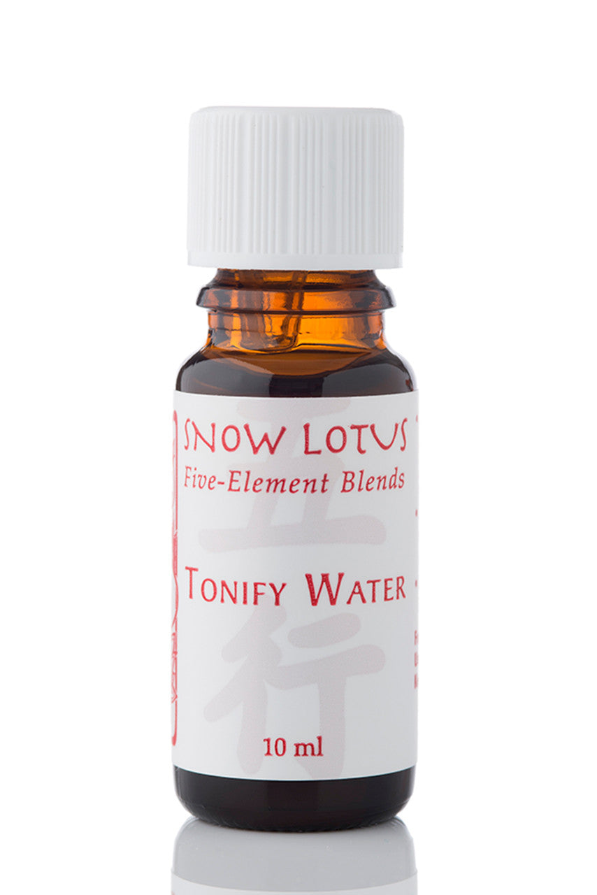 Snow Lotus Tonify Water - Five Element Essential Oil Blend in an amber glass bottle
