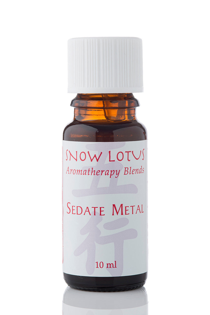 Snow Lotus Sedate Metal - Five Element Essential Oil Blend in an amber glass bottle