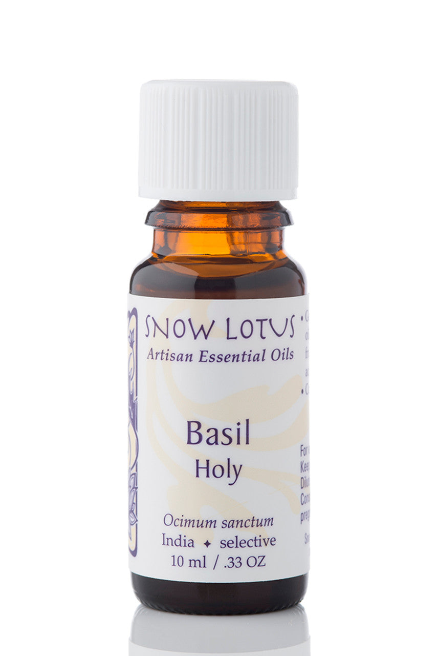 Snow Lotus Holy Basil Essential Oil in an amber glass bottle