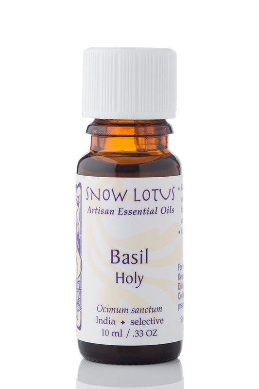 Snow Lotus Holy Basil Essential Oil in an amber glass bottle