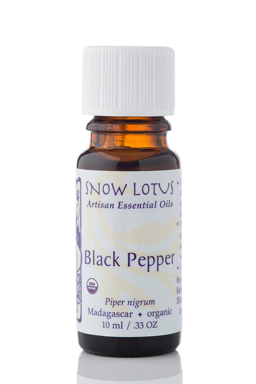 Snow Lotus organic Black Pepper Essential Oil in an amber glass bottle
