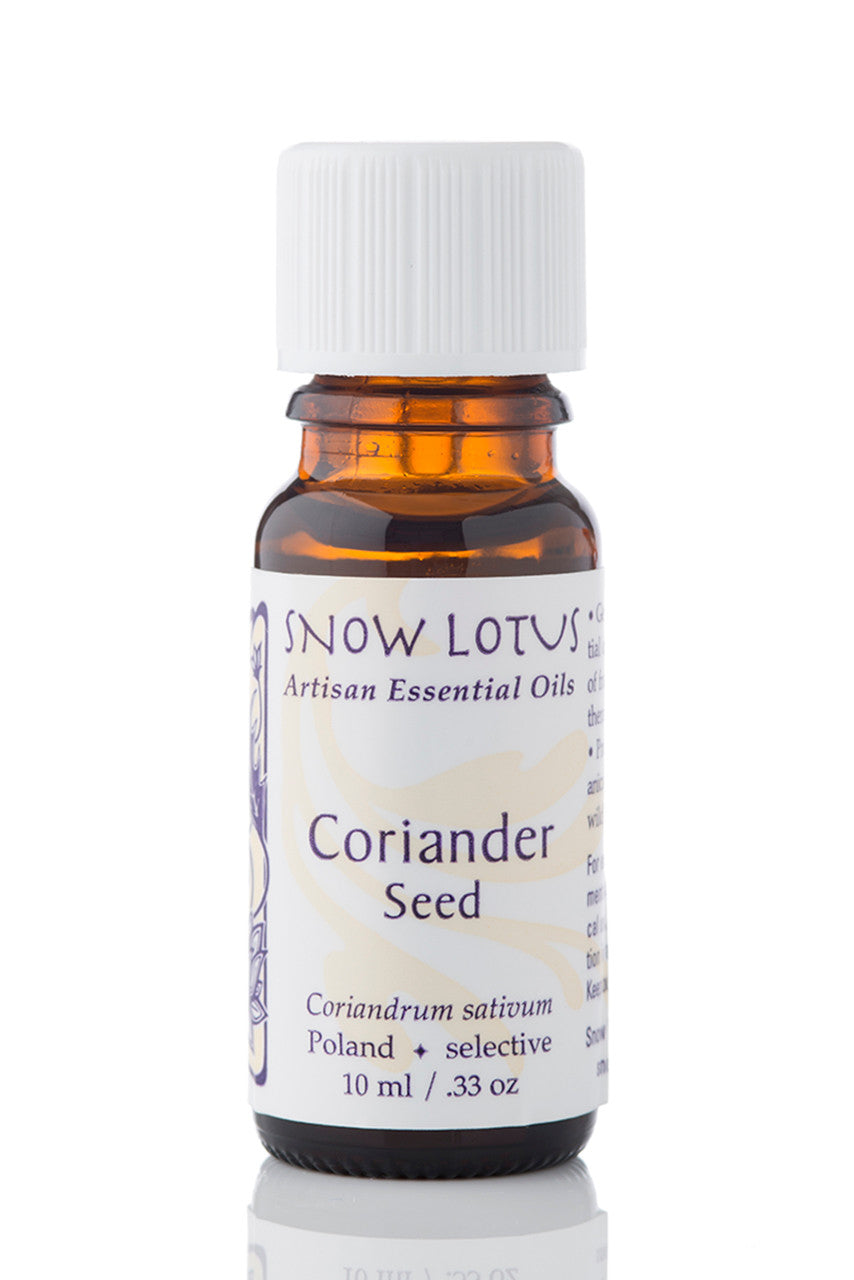 Snow Lotus Coriander Seed Essential Oil in an amber glass bottle