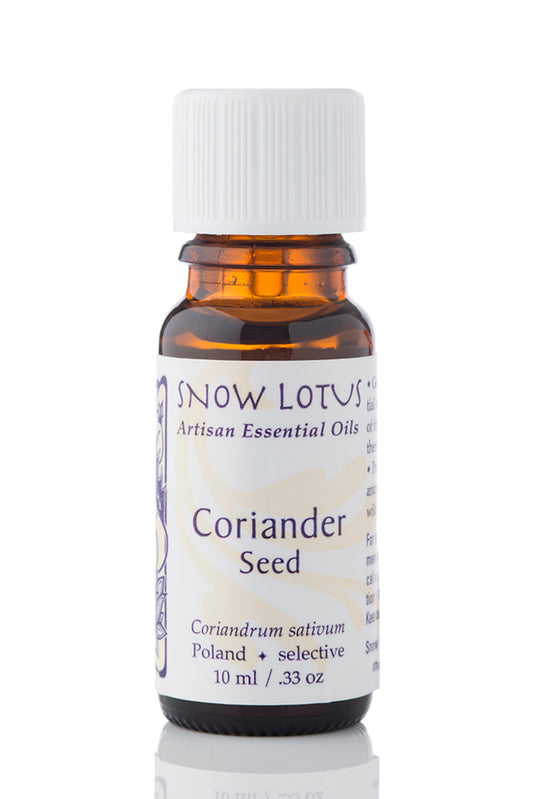 Snow Lotus Coriander Seed Essential Oil in an amber glass bottle