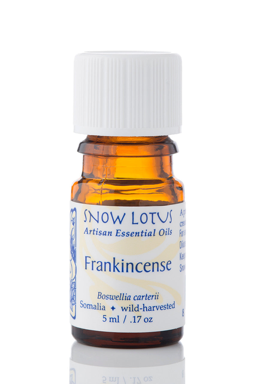 Snow Lotus Frankincense Essential Oil in an amber glass bottle