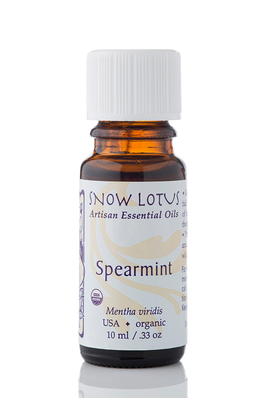 Snow Lotus Spearmint Essential Oil in an amber glass bottle