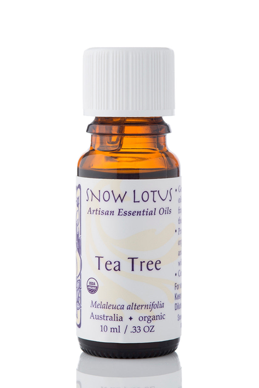 Snow Lotus organic Tea Tree Essential Oil in an amber glass bottle