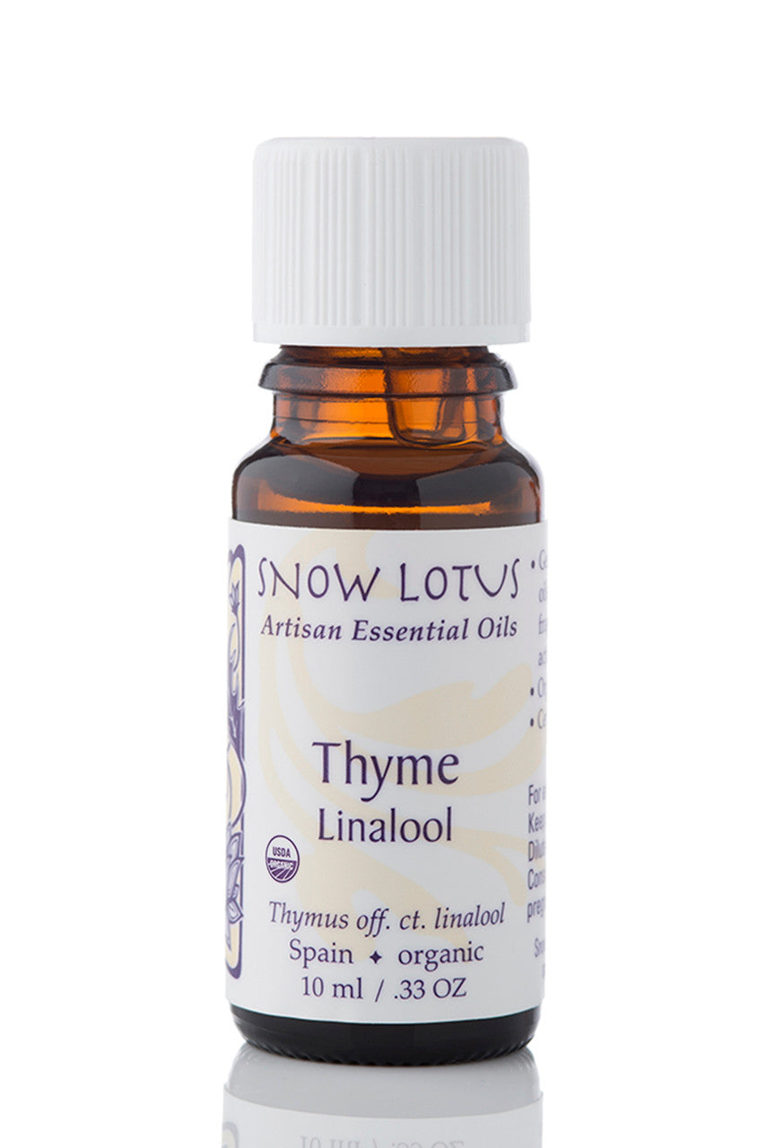 Snow Lotus organic Thyme Linalool Essential Oil in an amber glass bottle