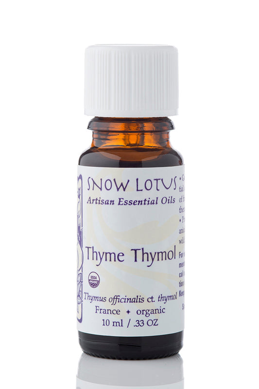 Snow Lotus organic Thyme Thymol Essential Oil in an amber glass bottle