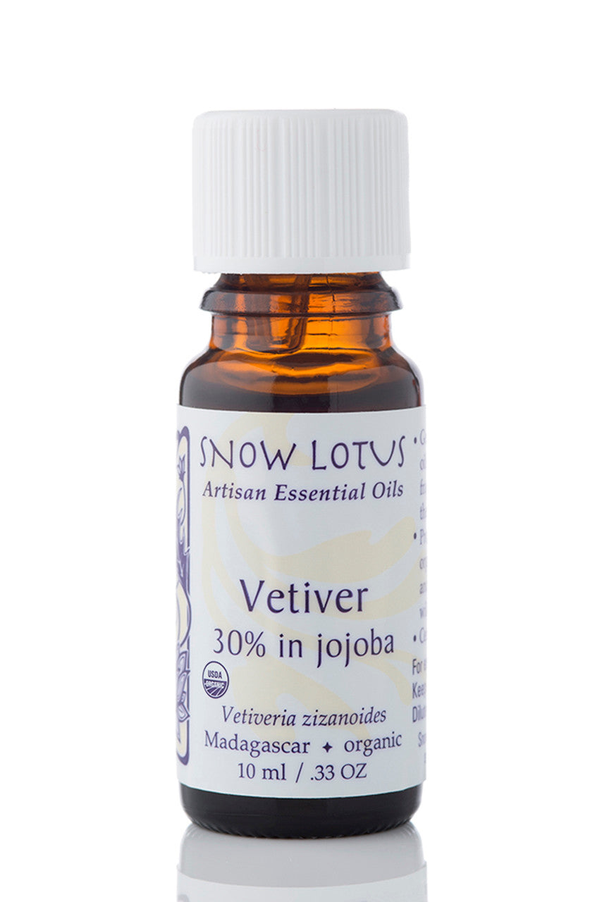 Snow Lotus organic Vetiver Essential Oil 30% in Jojoba in an amber glass bottle