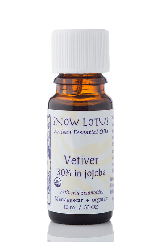 Snow Lotus organic Vetiver Essential Oil 30% in Jojoba in an amber glass bottle