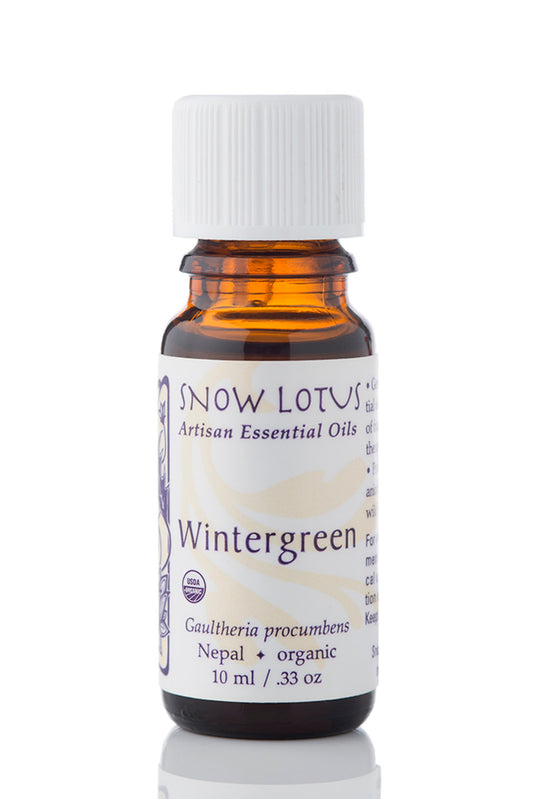 Snow Lotus organic Wintergreen Essential Oil in an amber glass bottle