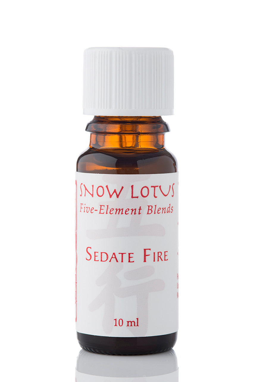 Snow Lotus Sedate Fire - Five Element Essential Oil Blend in an amber glass bottle