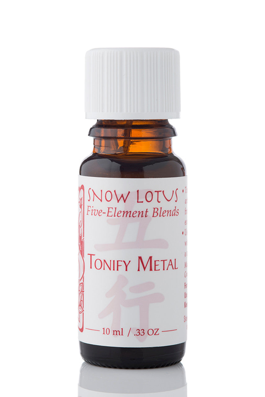 Snow Lotus Tonify Metal - Five Element Essential Oil Blend in an amber glass bottle