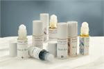A group of Snow Lotus roll-on and blend bottles arranged together