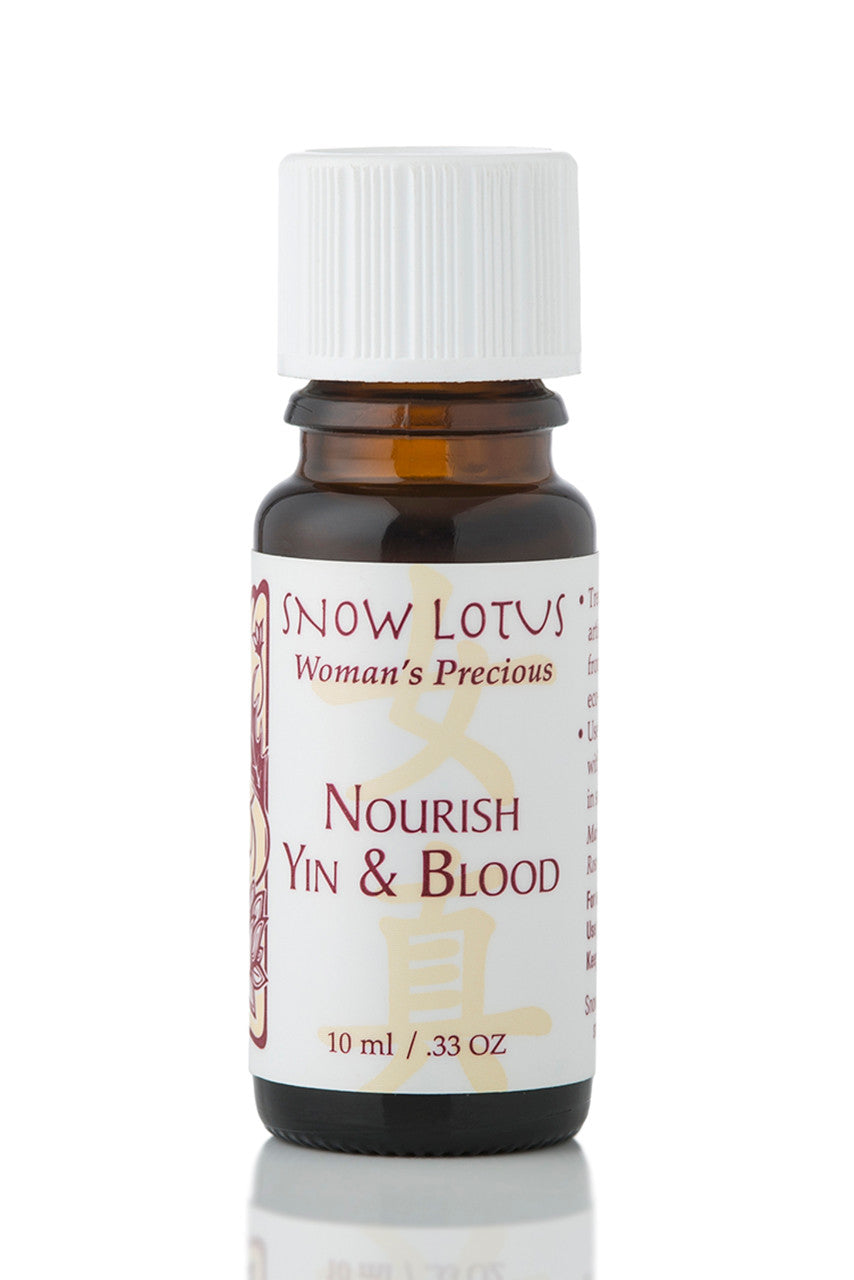 Snow Lotus Nourish Yin and Blood - Woman's Precious Blend in an amber glass bottle